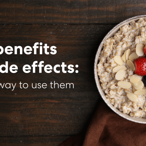 Bowl of oatmeal topped with strawberries, blueberries, almonds, and mint with text about oats benefits and side effects